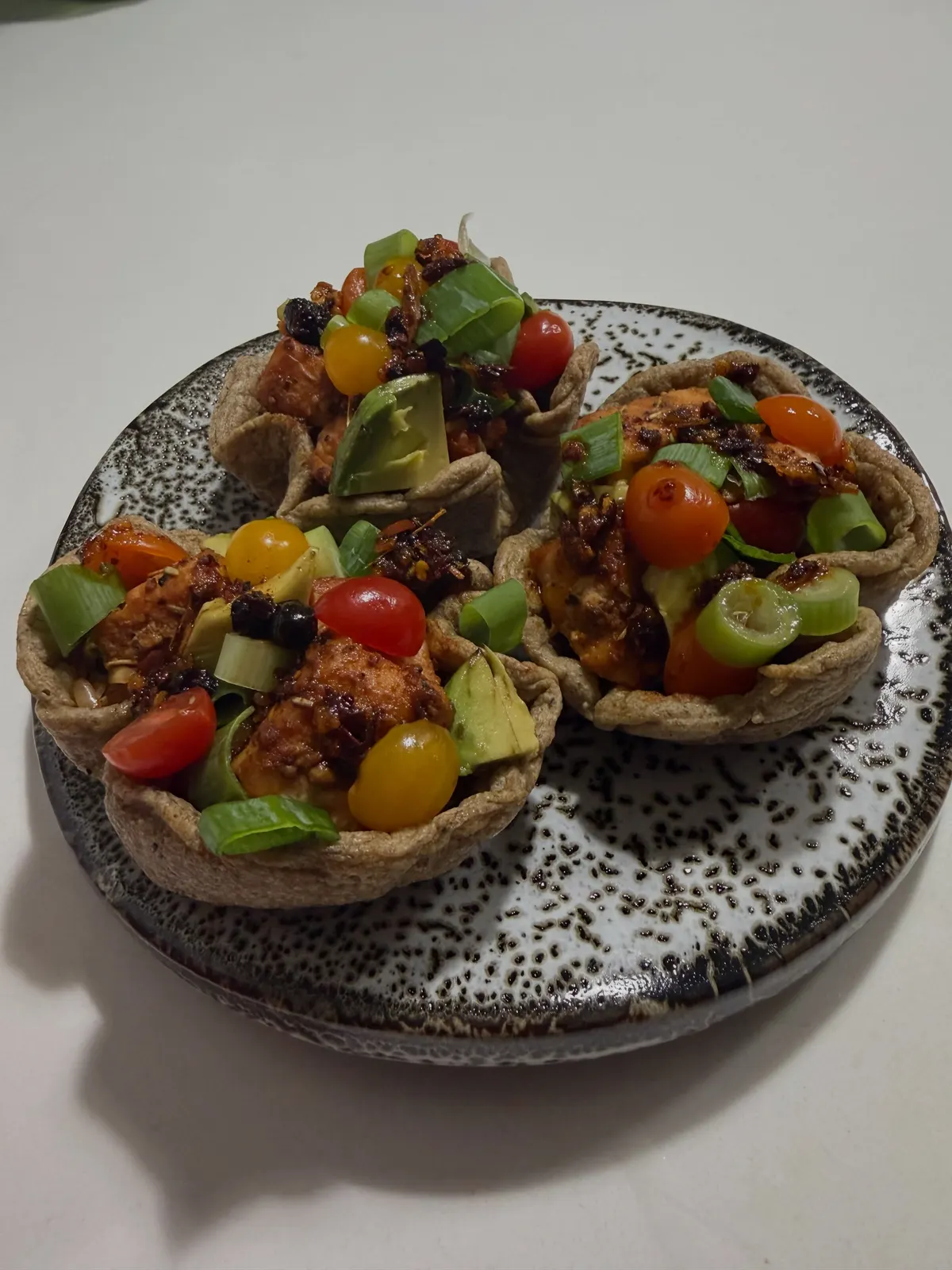 Jollof oat chia cups with salmon bites, avocado and cherry tomatoes