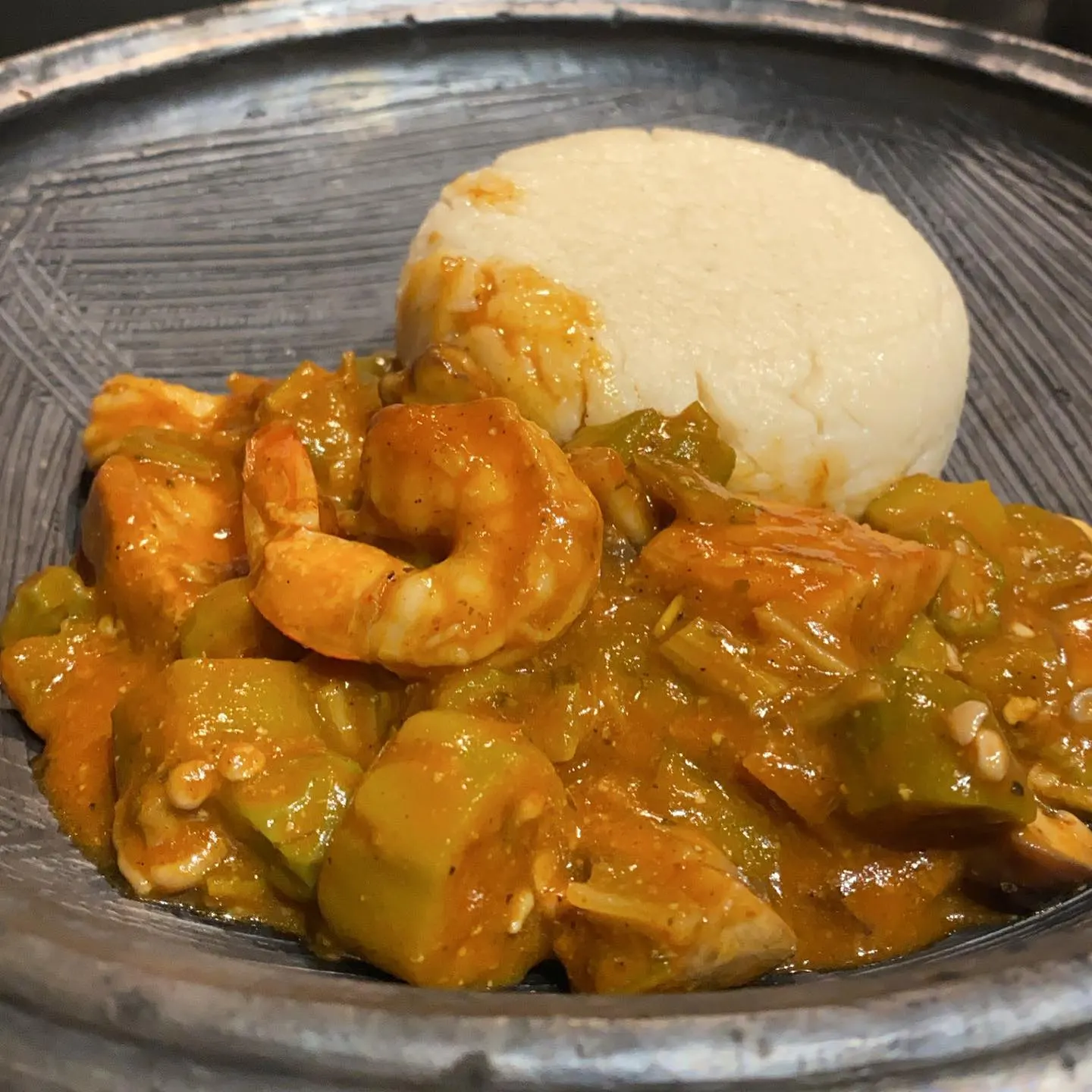 Akple and okra stew served in an asanka bowl